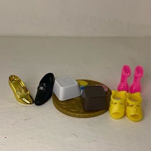 6 Barbie shoes and two other toys